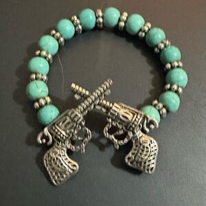 Turquoise Beaded Bracelet with Dueling Pistols.